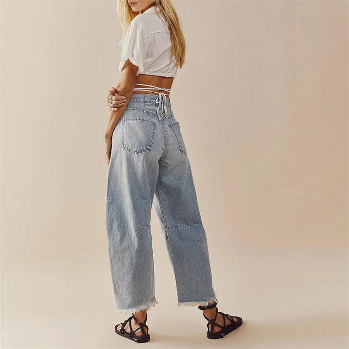 L'AURABLEND JEANS MED HÖG MIDJA OCH UTSVÄNGD DENIM